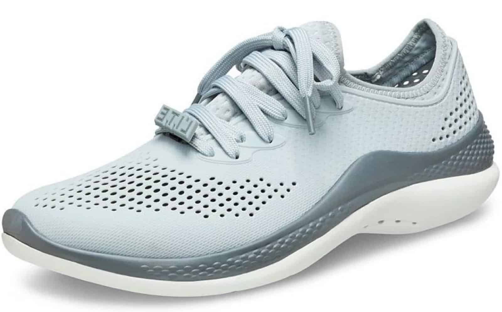 Person wearing Crocs LiteRide clogs while walking