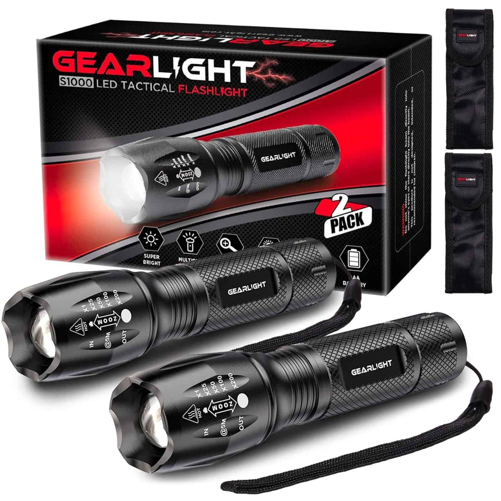 Hiker holding flashlight with wide beam in forest